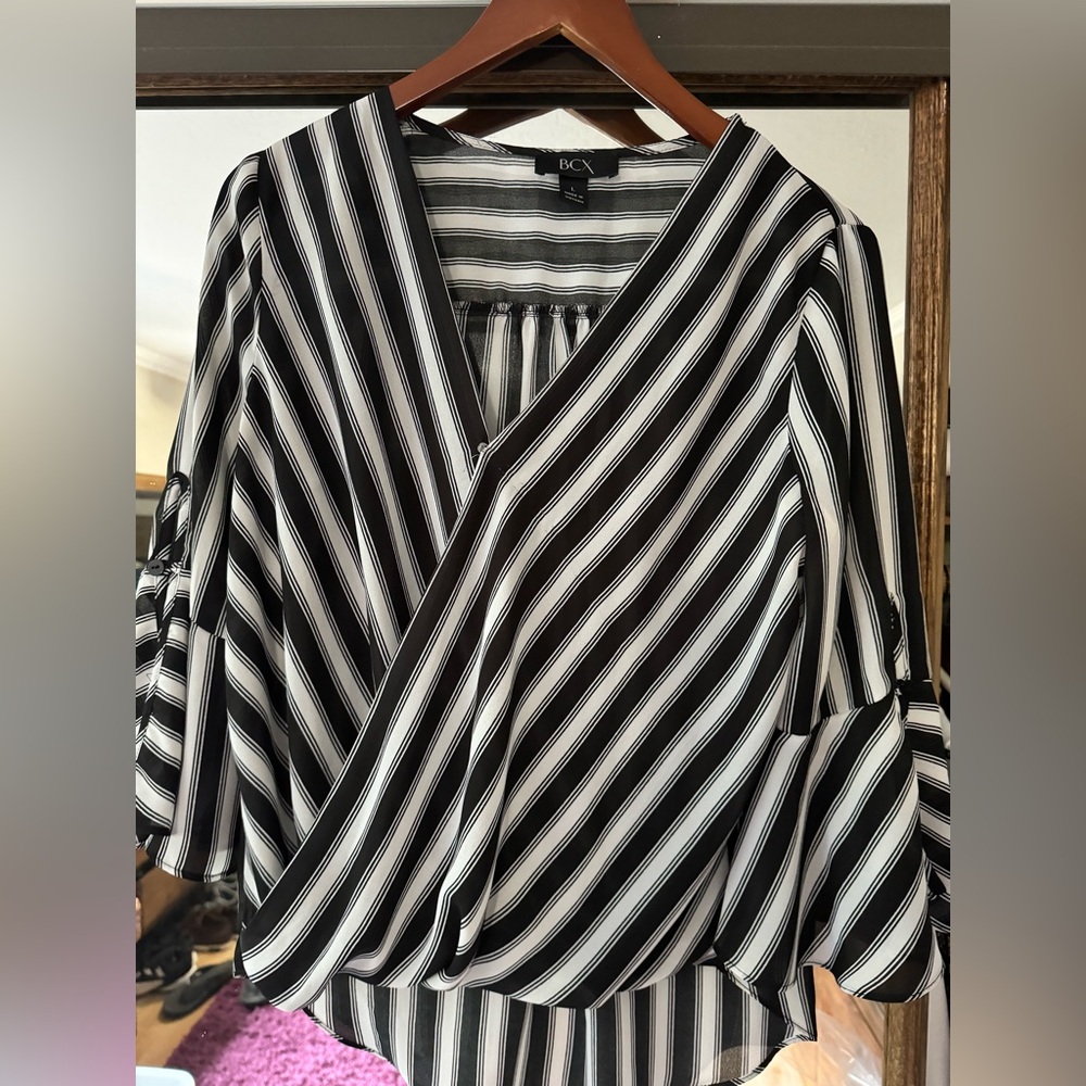 BCX black and white the striped wrap blouse with high low effect. Size large